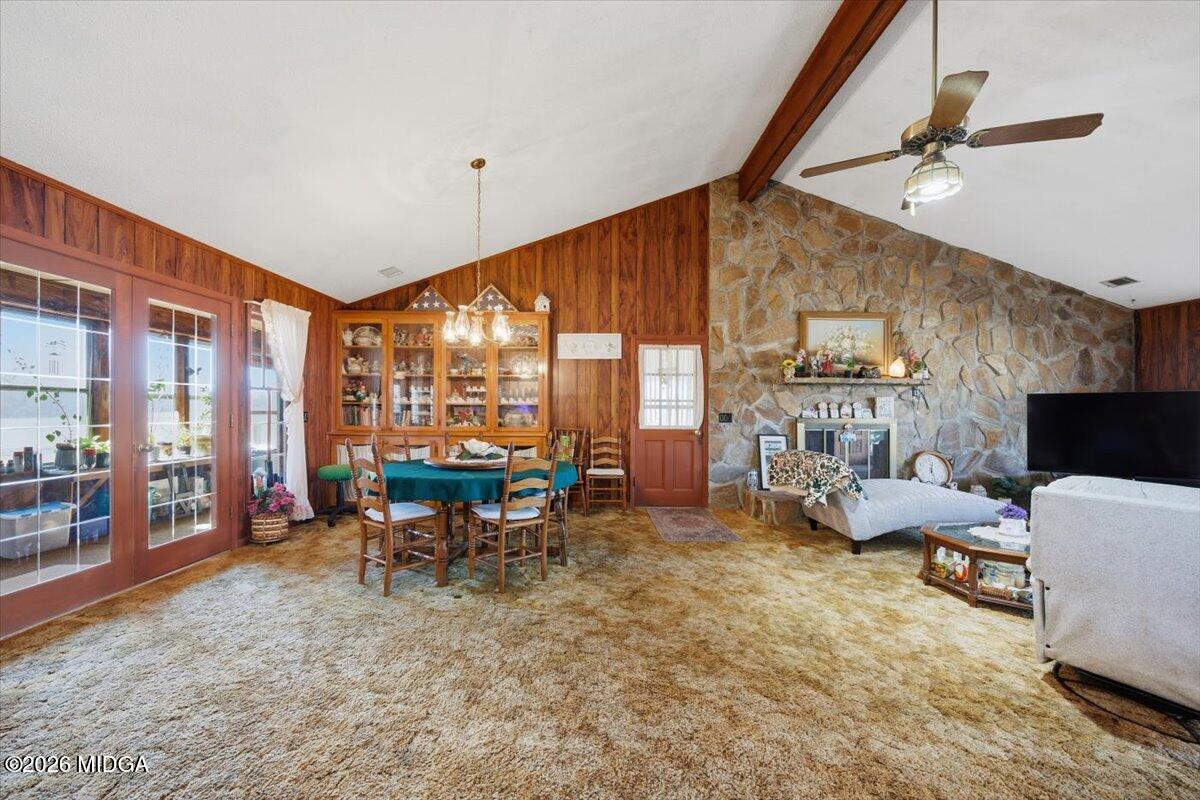 146 Mooring Road Hawkinsville, GA 31036 - Photo 25 of 64 a living room with furniture and a floor to ceiling window