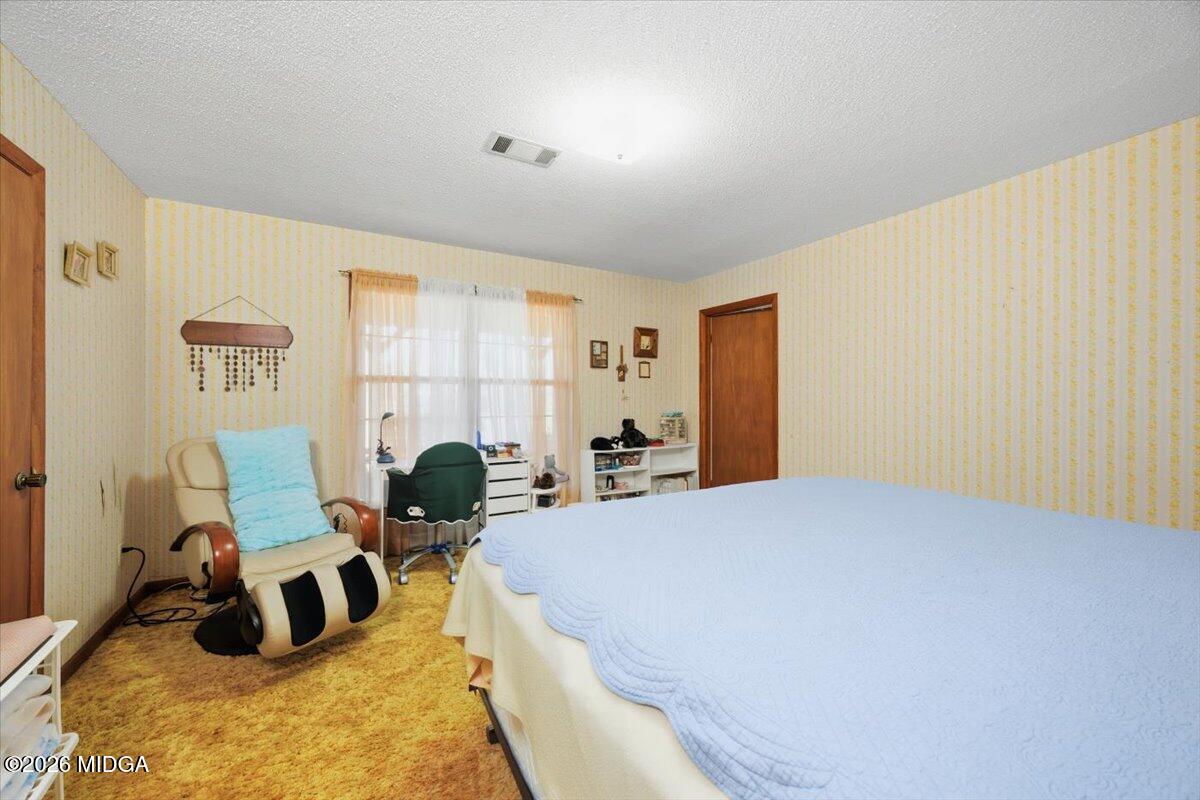 146 Mooring Road Hawkinsville, GA 31036 - Photo 26 of 64 a bed room with two bed and a window