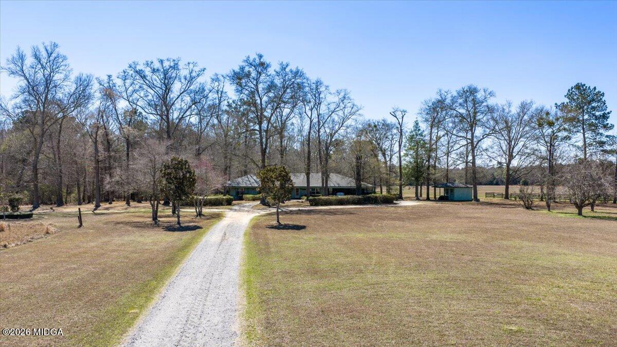 146 Mooring Road Hawkinsville, GA 31036 - Photo 3 of 64 a view of swimming pool with outdoor seating and trees in the background