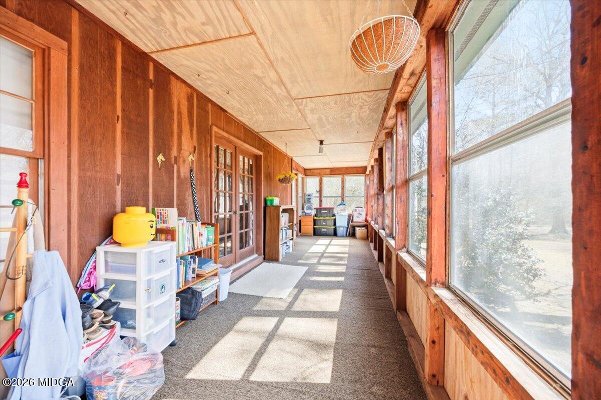 146 Mooring Road Hawkinsville, GA 31036 - Photo 43 of 64 a view of living room kitchen with furniture and floor to ceiling windows