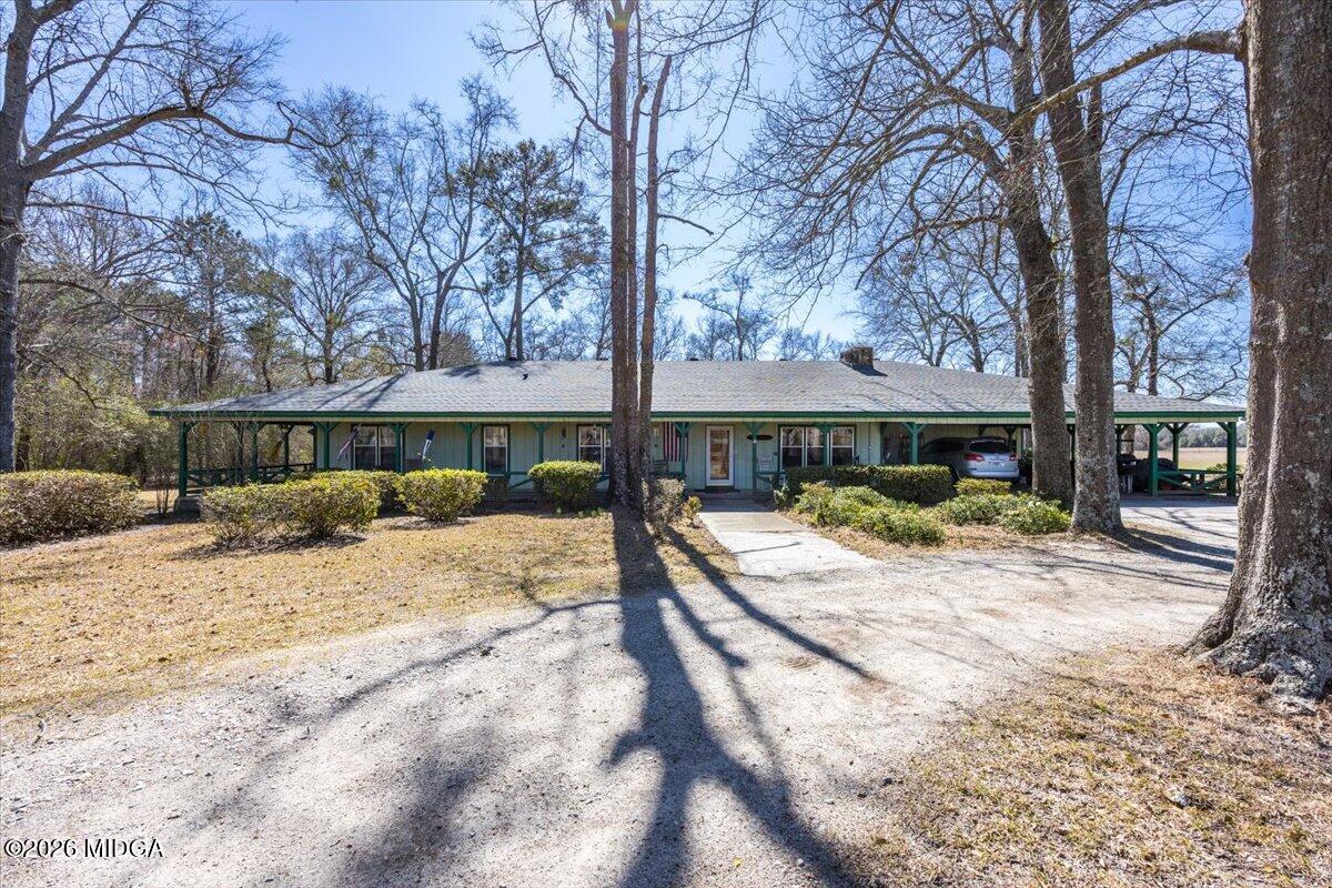 146 Mooring Road Hawkinsville, GA 31036 - Photo 6 of 64 a view of a house with a yard covered in snow