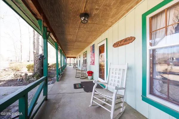 a front view of a house with a trees