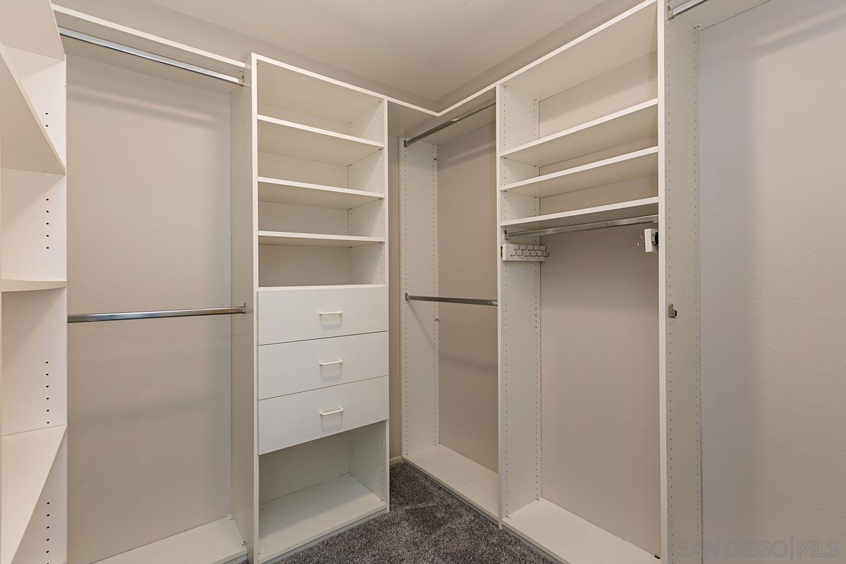 4031 Grayson Drive San Diego, CA 92130 - Photo 15 of 27 a view of walk in closet with empty racks
