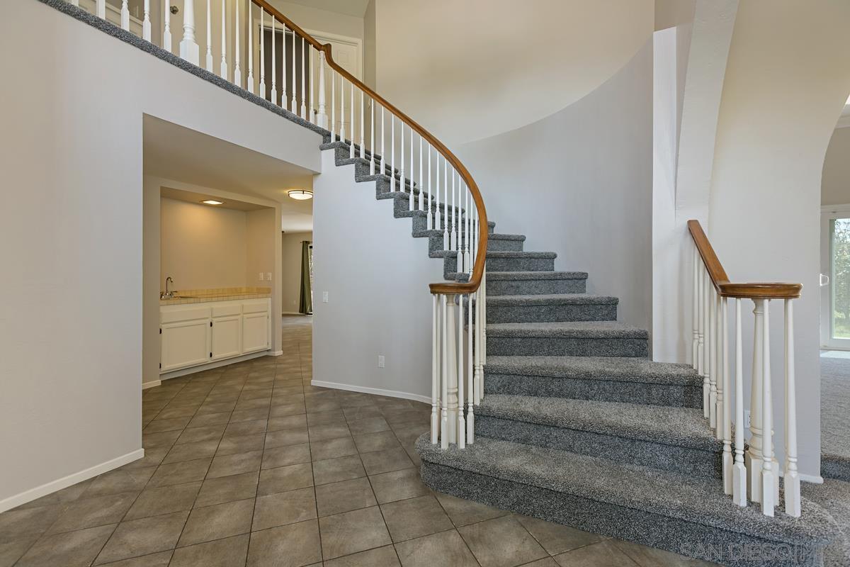 4031 Grayson Drive San Diego, CA 92130 - Photo 4 of 27 a view of entryway and hall with wooden floor