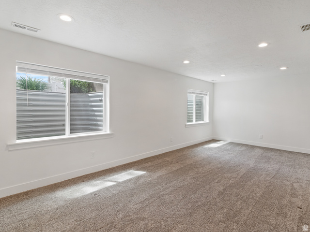 130 East 7085th South, Unit 3 Midvale, UT 84047 - Photo 25 of 30 Carpeted empty room with recessed lighting