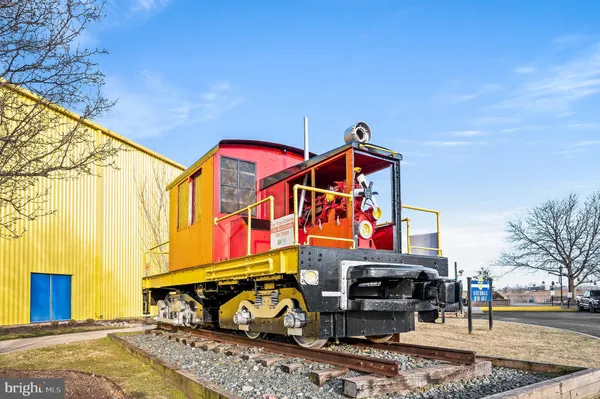 a view of a balcony with two chairs and a table