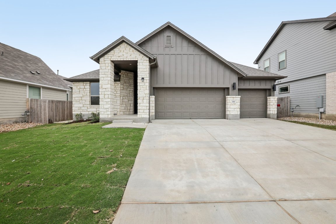 581 Treadwell Lane Kyle, TX 78640 - Photo 2 of 27 a front view of a house with a yard and garage