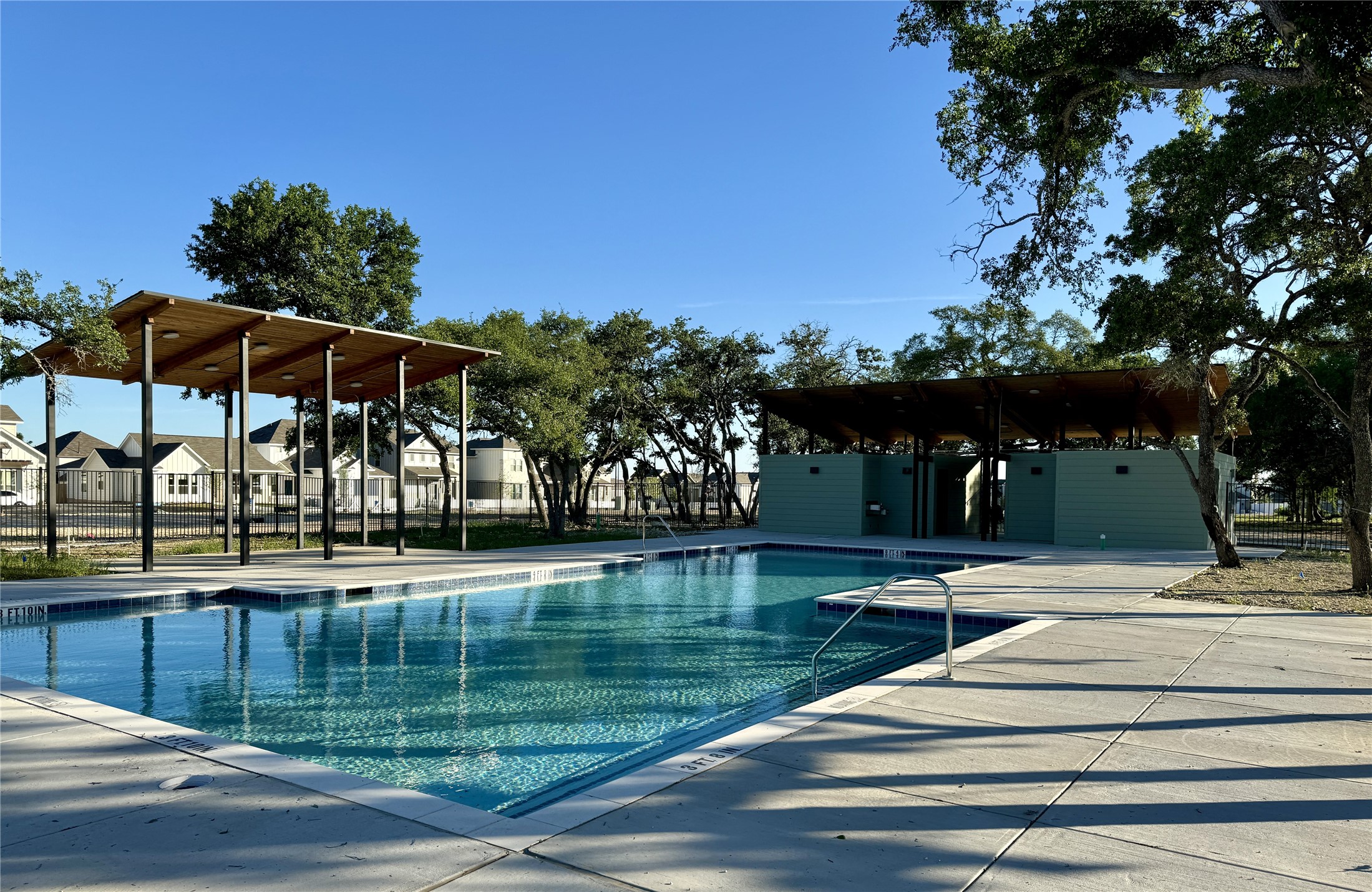 581 Treadwell Lane Kyle, TX 78640 - Photo 25 of 26 a view of a swimming pool with a patio