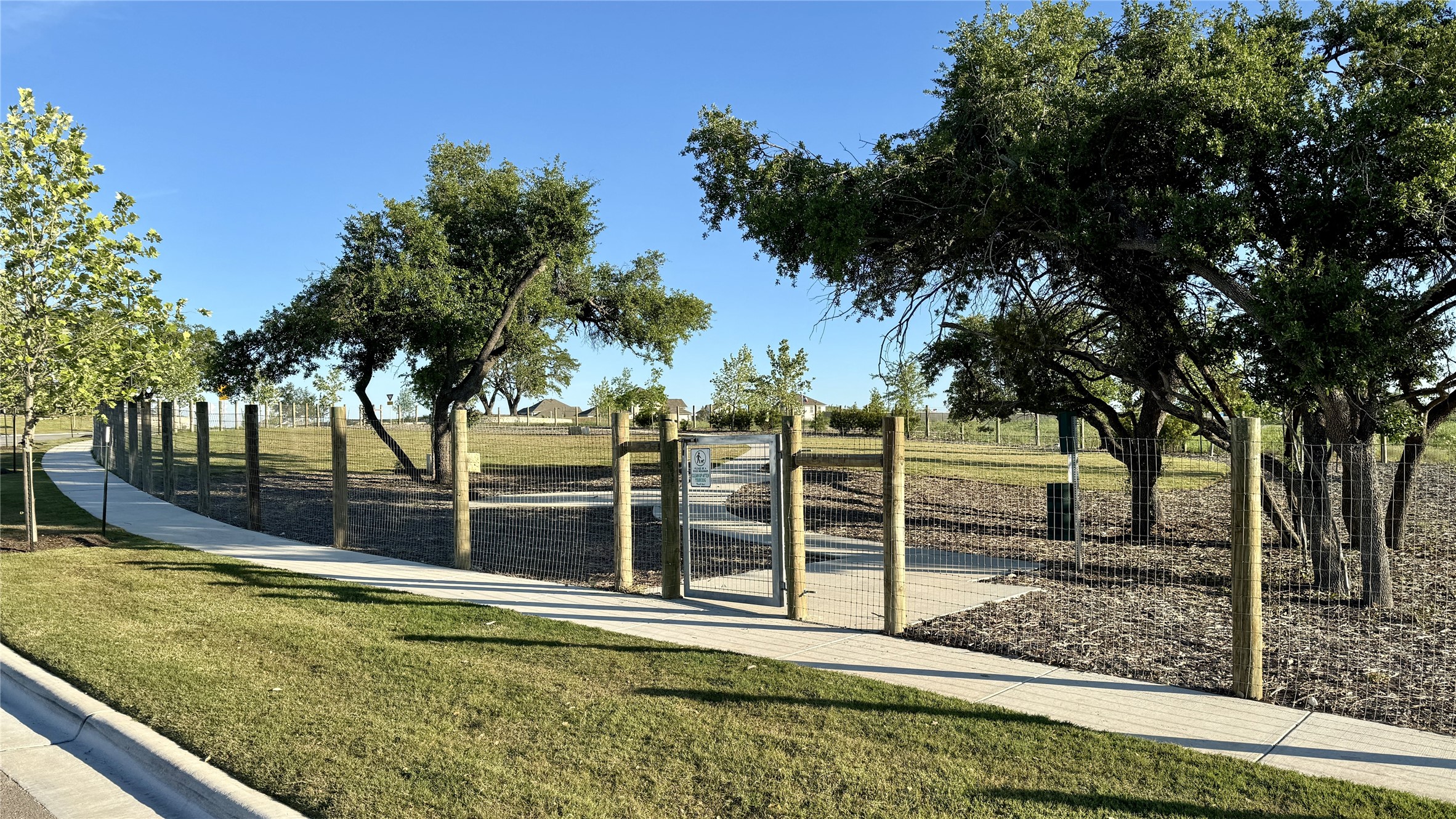 581 Treadwell Lane Kyle, TX 78640 - Photo 26 of 26 a view of a backyard with wooden fence