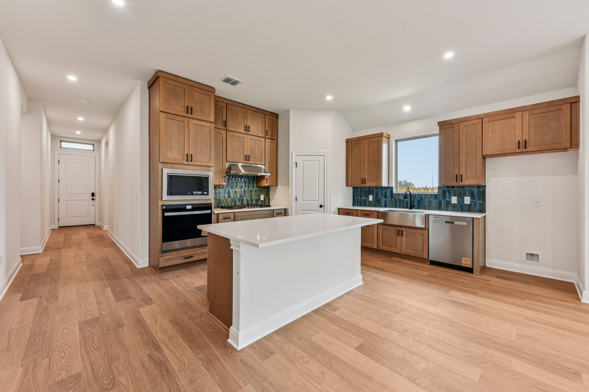 581 Treadwell Lane Kyle, TX 78640 - Photo 4 of 26 a large kitchen with stainless steel appliances