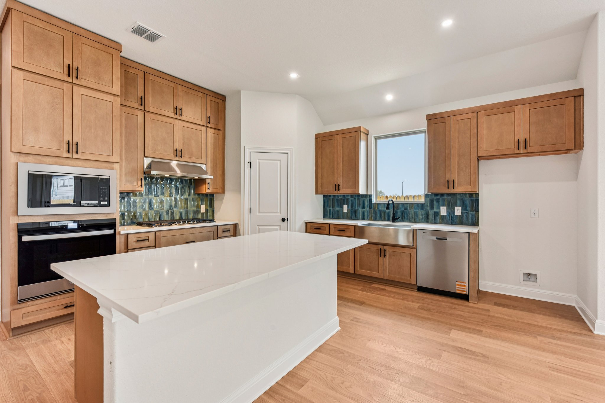 581 Treadwell Lane Kyle, TX 78640 - Photo 5 of 26 a large white kitchen with a large window