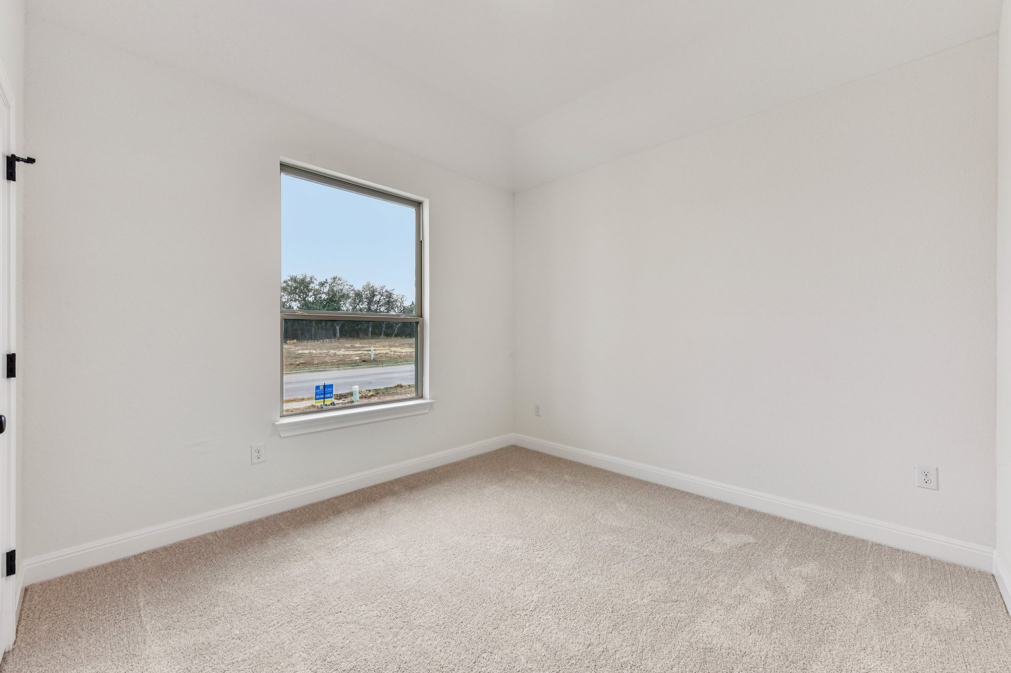 581 Treadwell Lane Kyle, TX 78640 - Photo 8 of 26 a view of an empty room with a window