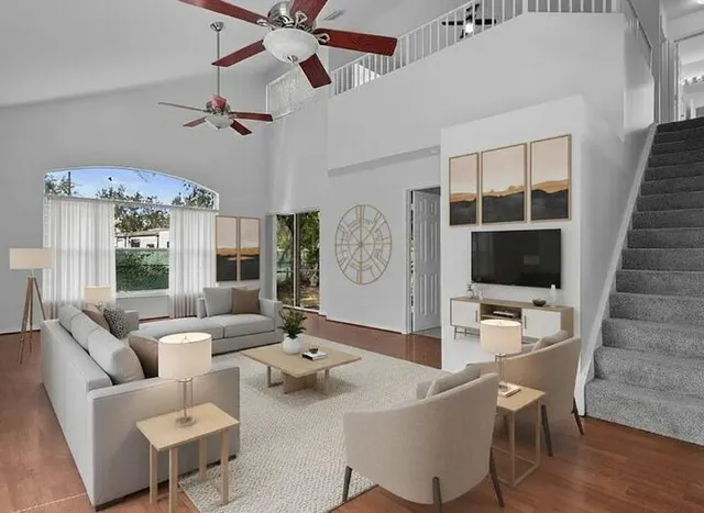 a living room with furniture and a flat screen tv