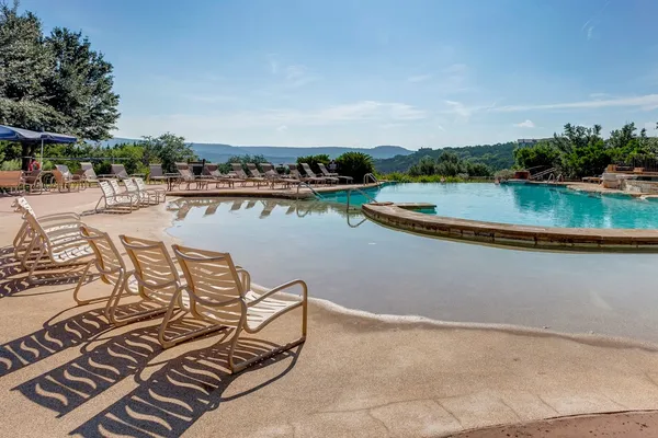 an outdoor space with lounge chair