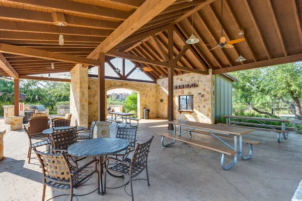 a view of a patio with a table and chairs