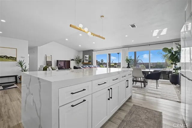 a kitchen with kitchen island granite countertop lots of counter top space