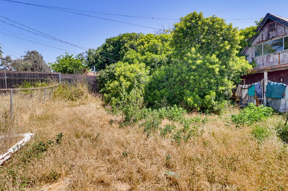 736 Sacramento Avenue Spring Valley, CA 91977 - Photo 31 of 33 a backyard of a house with lots of green space and lake view
