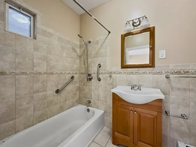 a bathroom with a sink toilet tub and shower