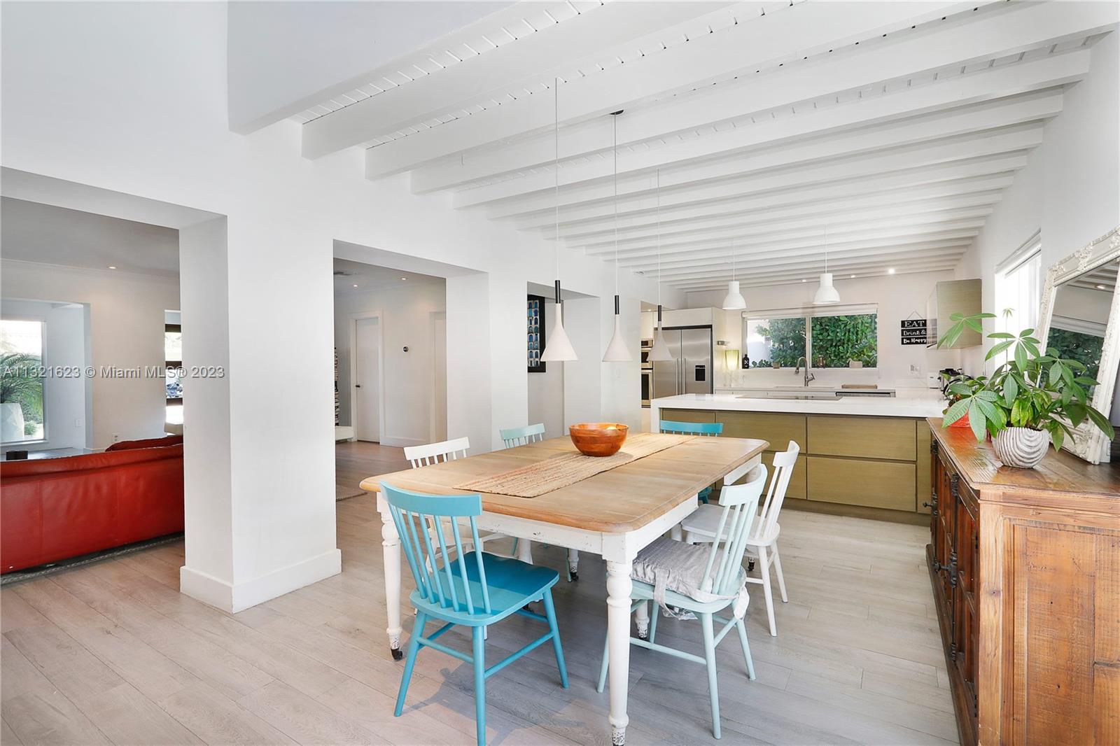 425 Glenridge Road Key Biscayne, FL 33149 - Photo 11 of 37 a dining room with furniture and wooden floor