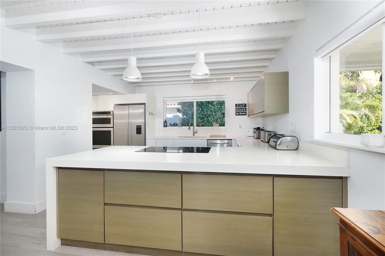 425 Glenridge Road Key Biscayne, FL 33149 - Photo 14 of 37 a kitchen with a sink and a window