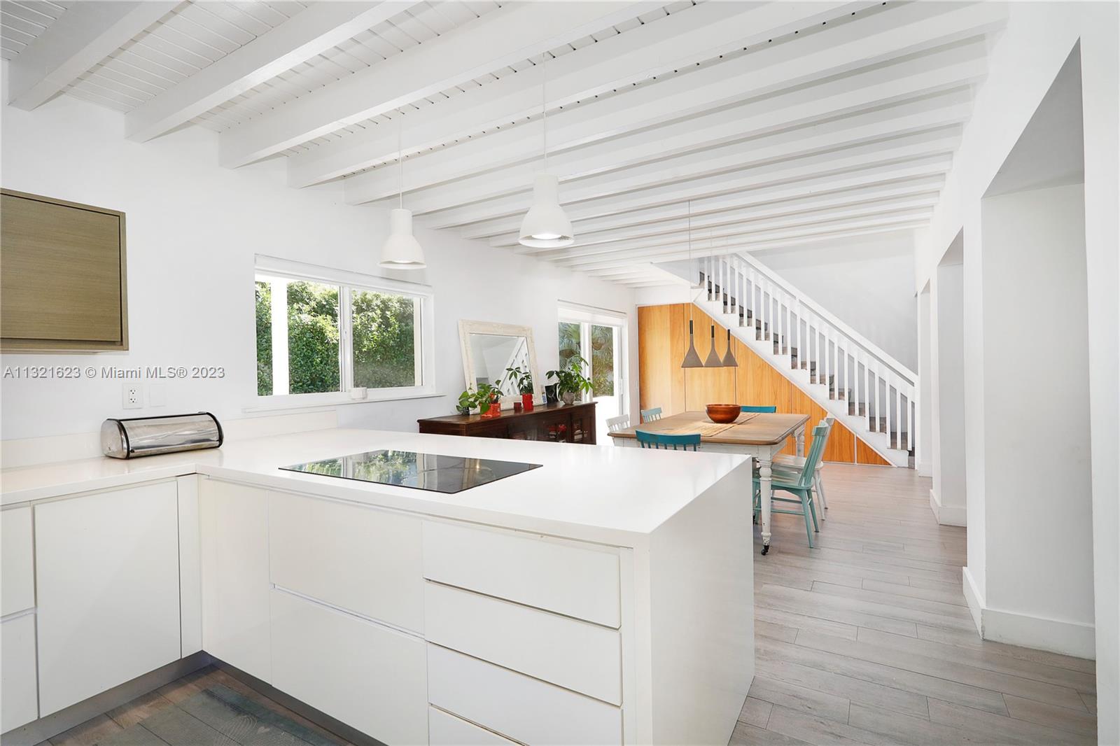 425 Glenridge Road Key Biscayne, FL 33149 - Photo 15 of 37 a kitchen with a sink and a wooden floor