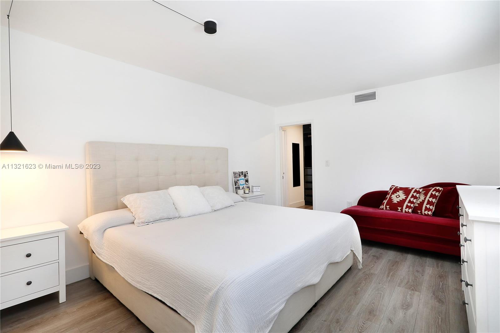 425 Glenridge Road Key Biscayne, FL 33149 - Photo 16 of 37 a bedroom with a bed and a couch