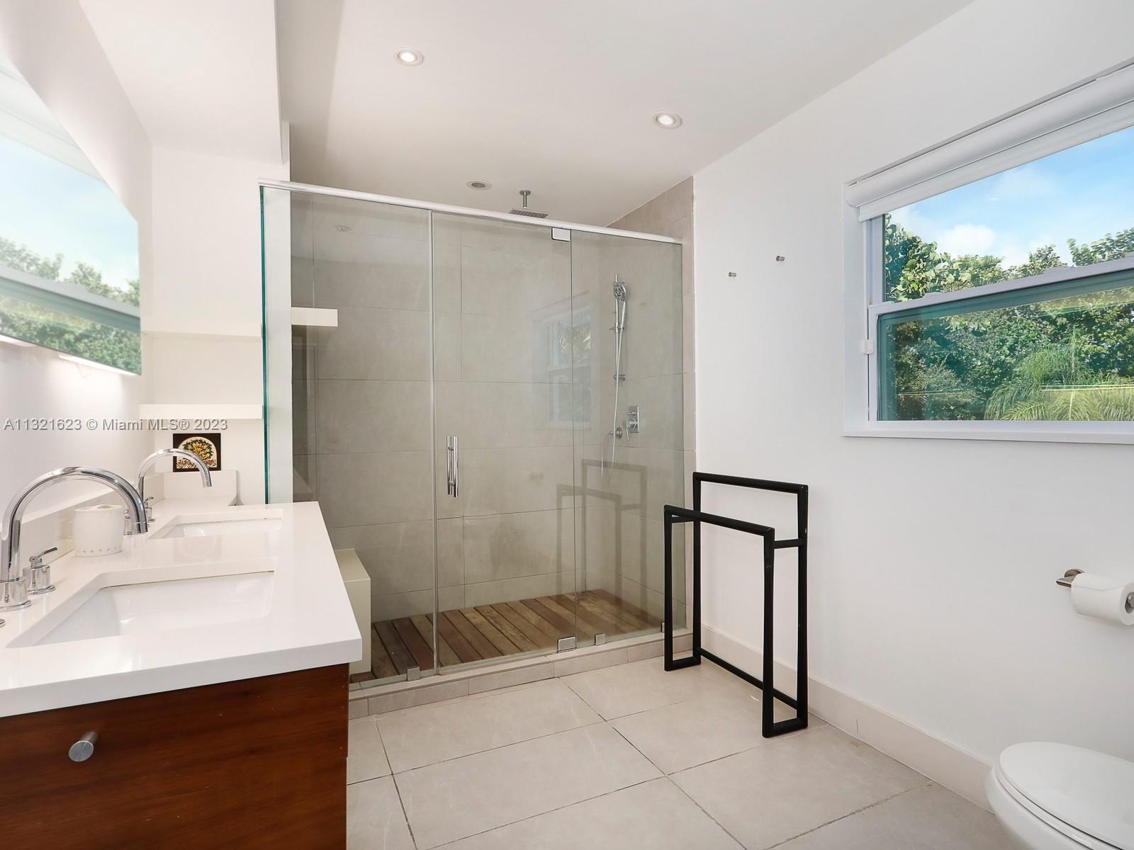 425 Glenridge Road Key Biscayne, FL 33149 - Photo 18 of 37 a bathroom with a sink toilet and shower