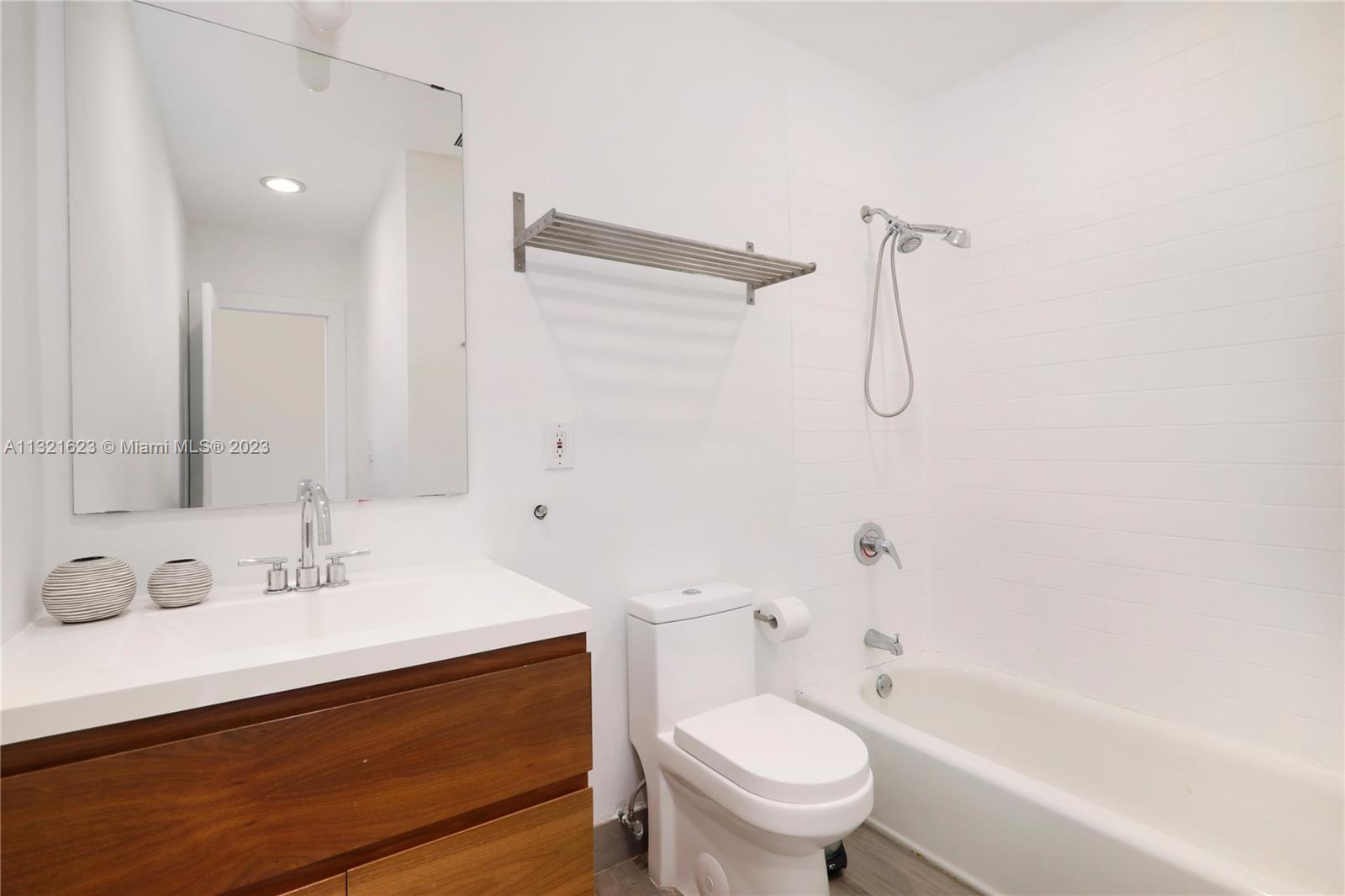 425 Glenridge Road Key Biscayne, FL 33149 - Photo 22 of 37 a bathroom with a sink a toilet and shower