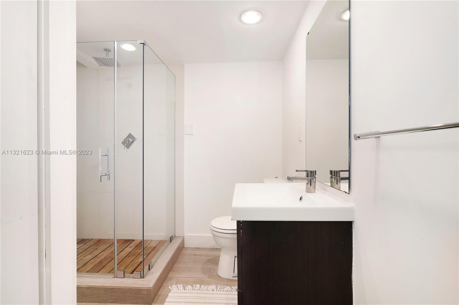 425 Glenridge Road Key Biscayne, FL 33149 - Photo 24 of 37 a bathroom with a sink and a mirror