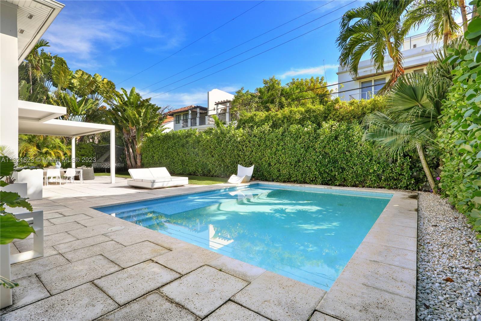 425 Glenridge Road Key Biscayne, FL 33149 - Photo 30 of 37 a view of swimming pool with sitting area