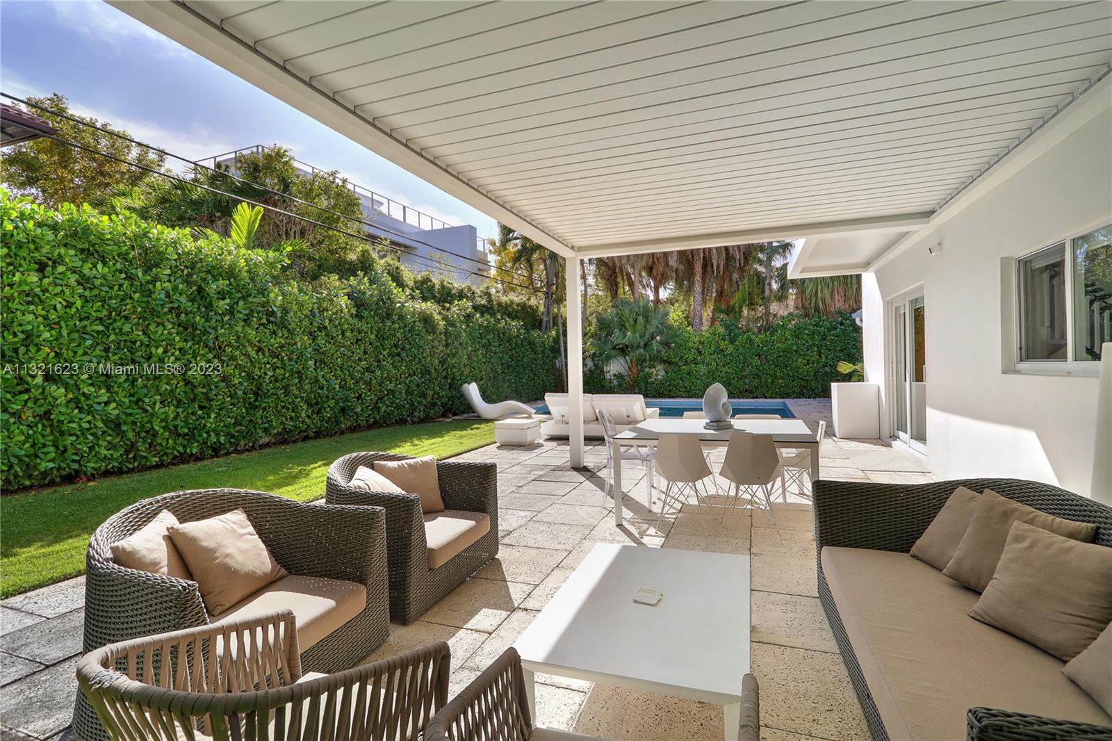 425 Glenridge Road Key Biscayne, FL 33149 - Photo 32 of 37 a view of patio with couches and pool