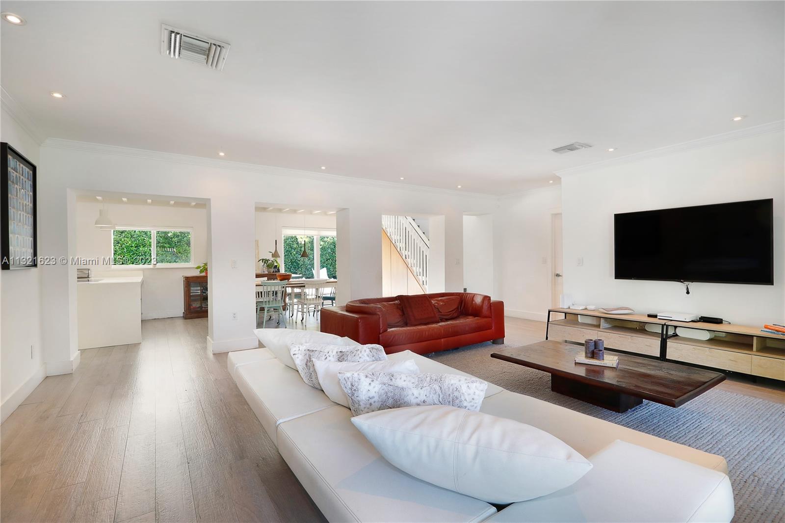 425 Glenridge Road Key Biscayne, FL 33149 - Photo 6 of 37 a living room with furniture and a flat screen tv