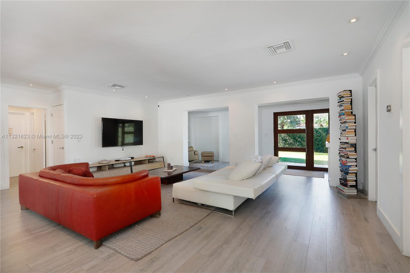 425 Glenridge Road Key Biscayne, FL 33149 - Photo 8 of 37 a living room with furniture and a flat screen tv