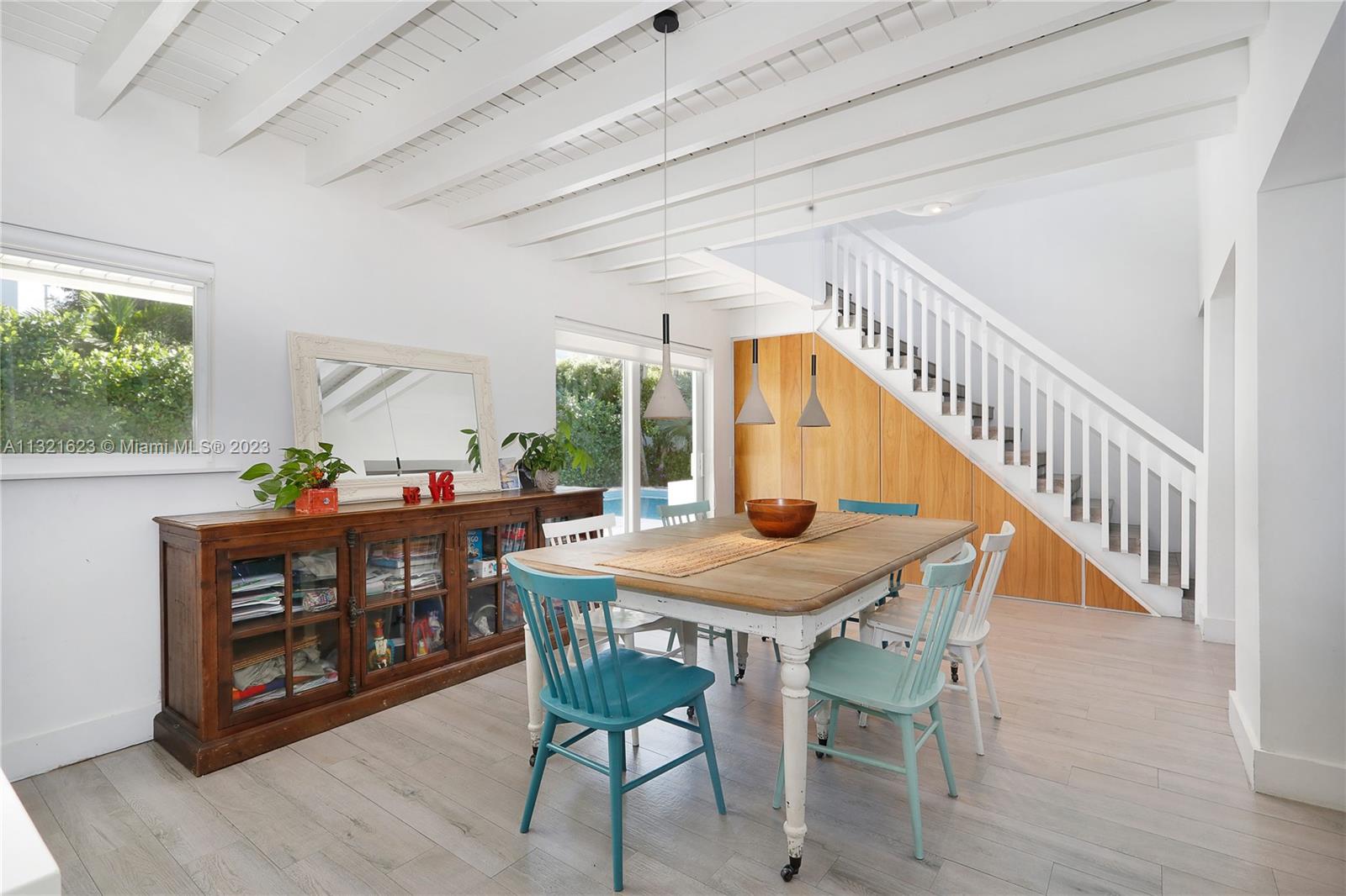 425 Glenridge Road Key Biscayne, FL 33149 - Photo 10 of 37 a view of a dining room with furniture window and wooden floor