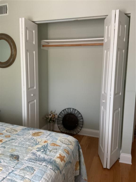2655 Pine Ridge Way North, Unit D3 Palm Harbor, FL 34684 - Photo 19 of 31 a bedroom with a bed and a window