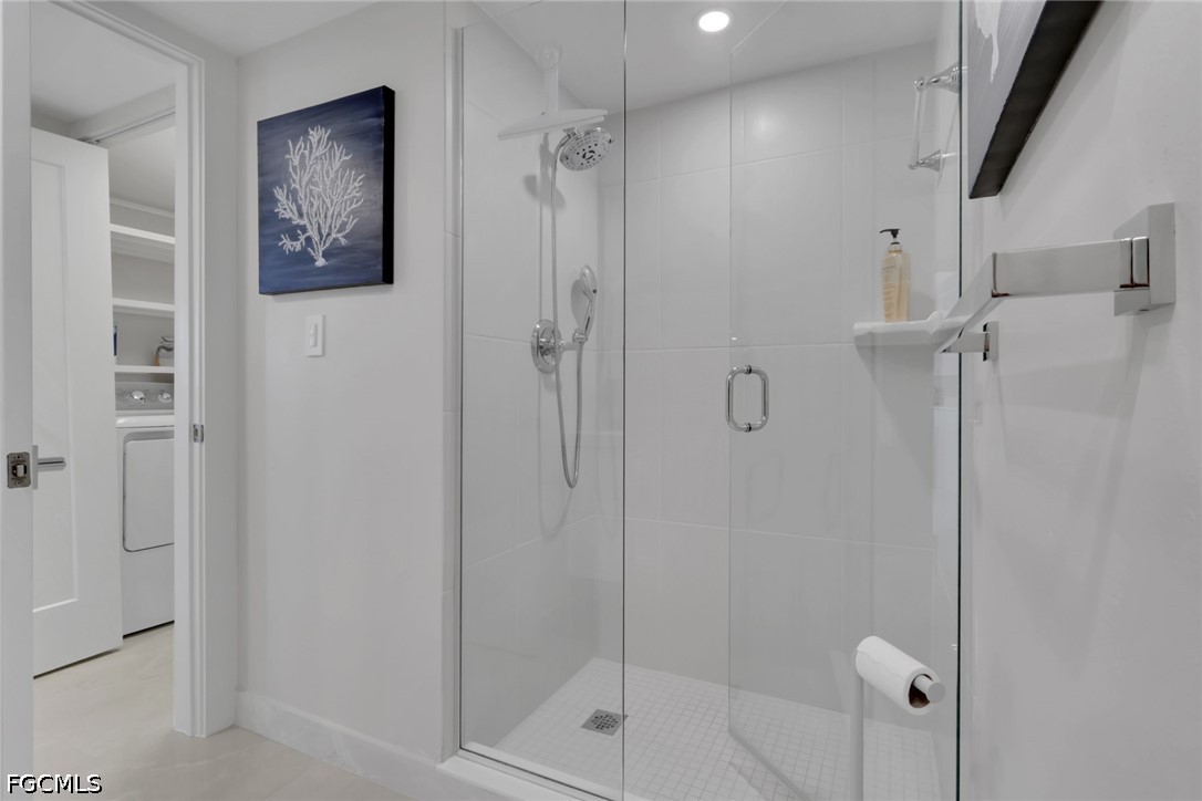 9 High Point Circle North, Unit 101 Naples, FL 34103 - Photo 32 of 49 a bathroom with a shower