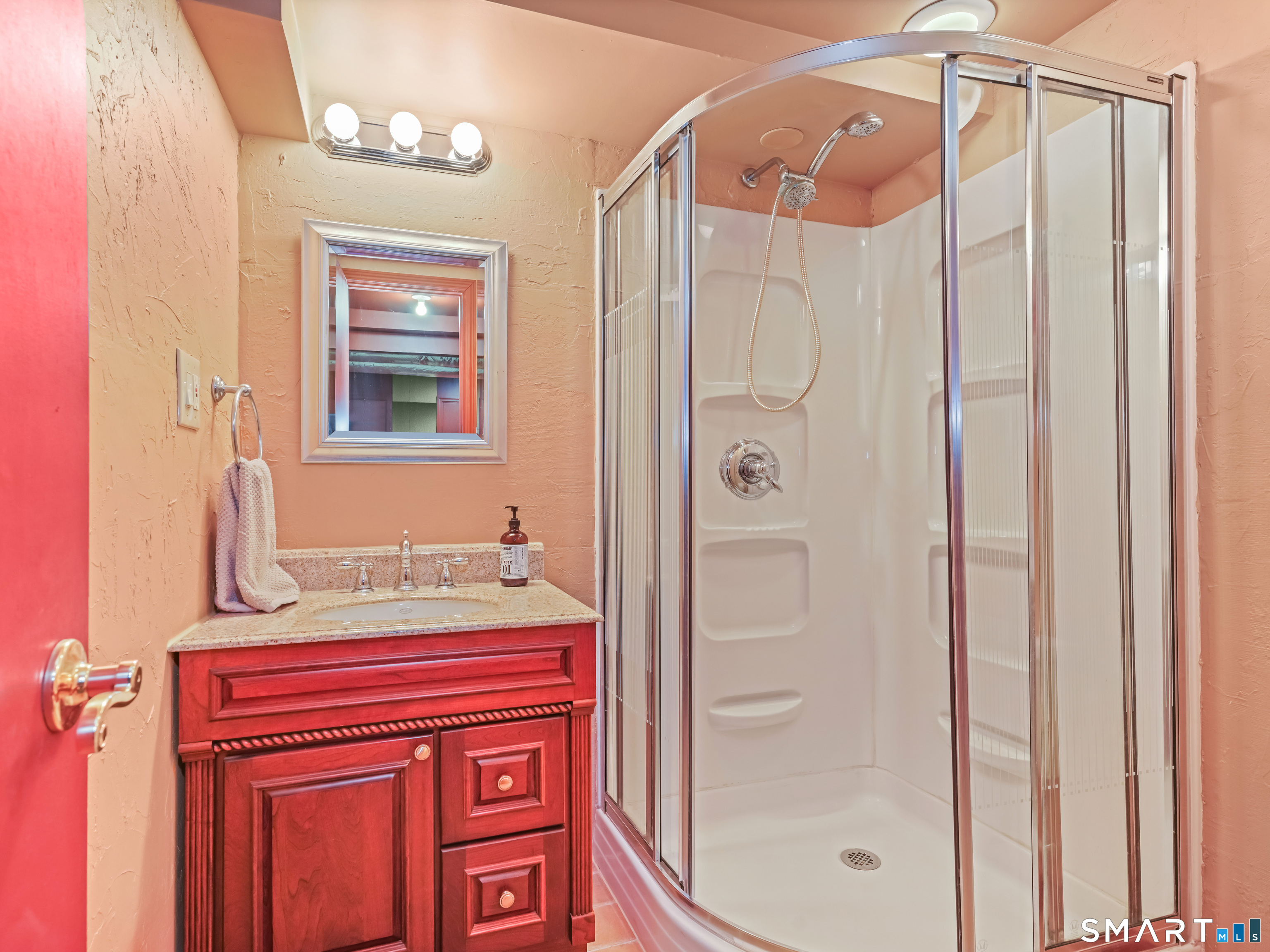 82 Ramapoo Road Ridgefield, CT 06877 - Photo 37 of 40 a bathroom with a shower and a sink
