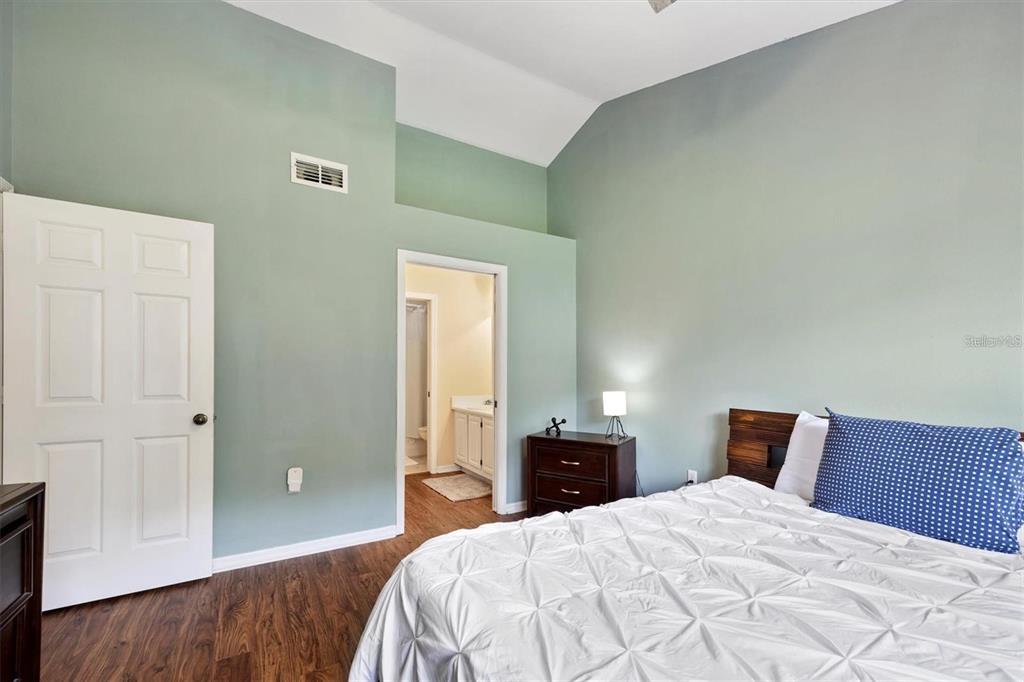10000 Southwest 52nd Avenue, Unit EE 183 Gainesville, FL 32608 - Photo 11 of 16 a bedroom with a bed and a dresser