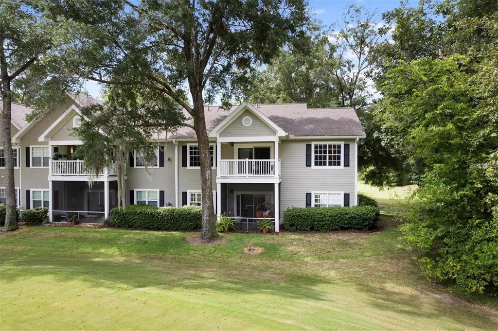 10000 Southwest 52nd Avenue, Unit EE 183 Gainesville, FL 32608 - Photo 15 of 16 a front view of a house with a garden