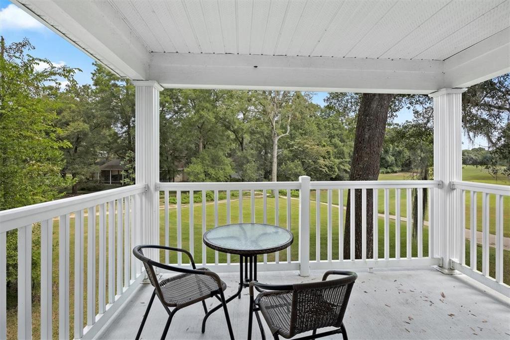 10000 Southwest 52nd Avenue, Unit EE 183 Gainesville, FL 32608 - Photo 2 of 16 a view of a balcony with table and chairs
