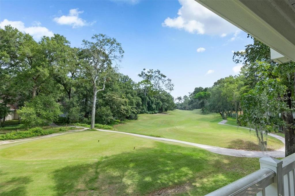 10000 Southwest 52nd Avenue, Unit EE 183 Gainesville, FL 32608 - Photo 3 of 16 a view of a golf course with a trees