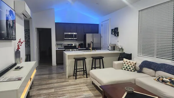 a kitchen with a sink appliances and cabinets
