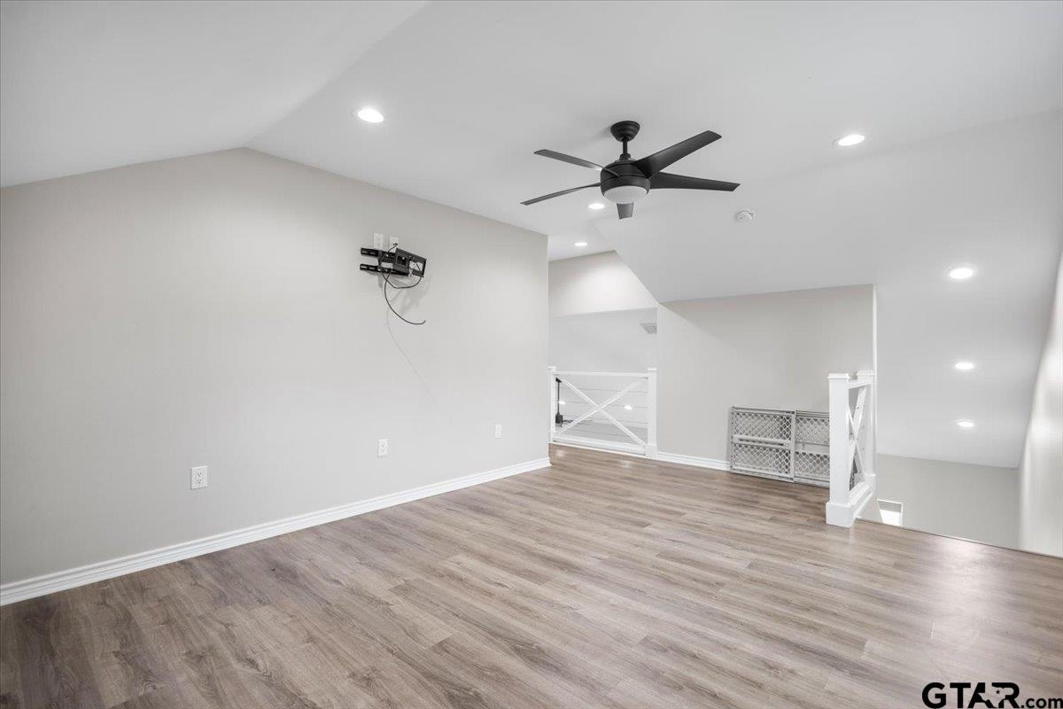 9235 Farm To Market Road 851 Rusk, TX 75785 - Photo 30 of 47 wooden floor in an empty room with a window