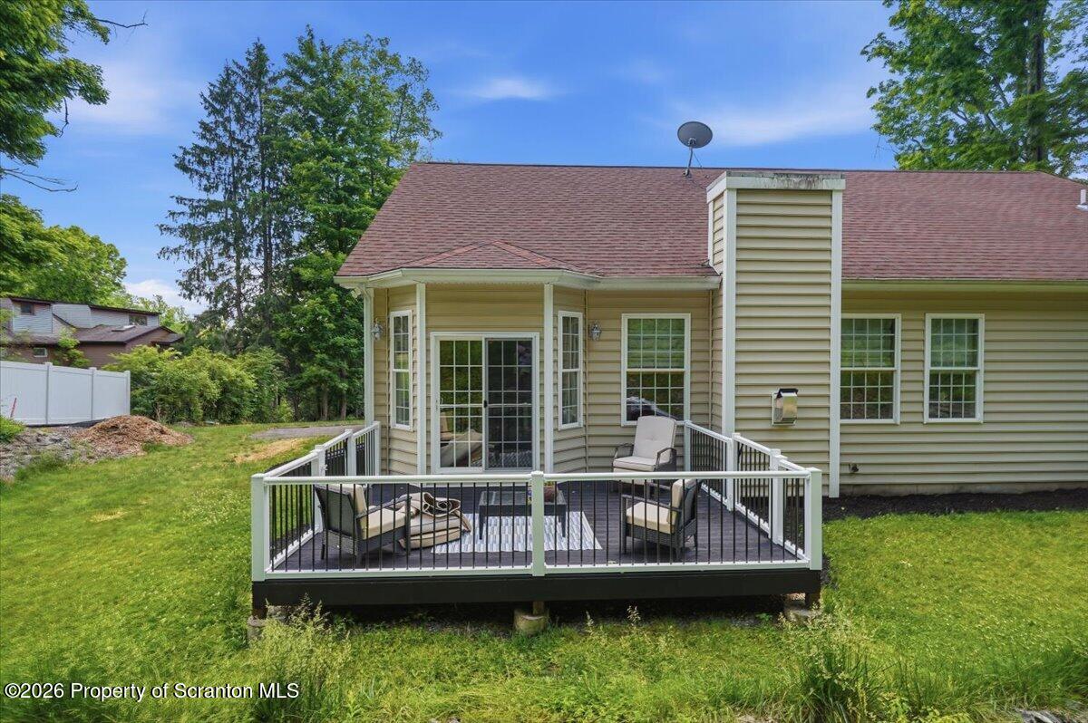 99 Hilltop Road Waverly, PA 18471 - Photo 37 of 41 a view of a house with a small yard and sitting area