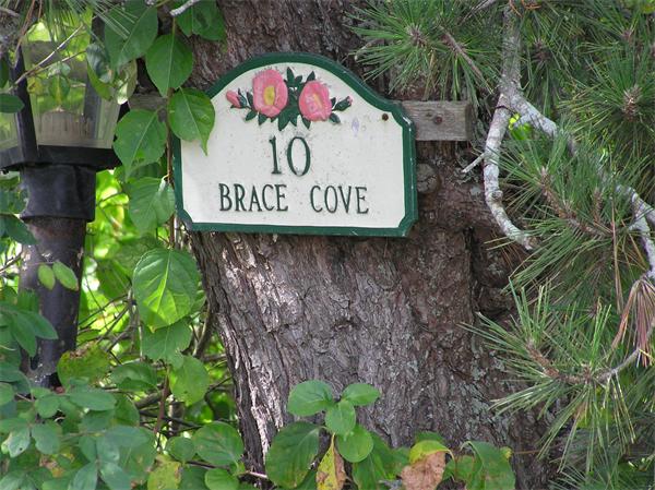 10 Brace Cove Gloucester, MA 01930 - Photo 11 of 13 a sign that is sitting on a brick wall