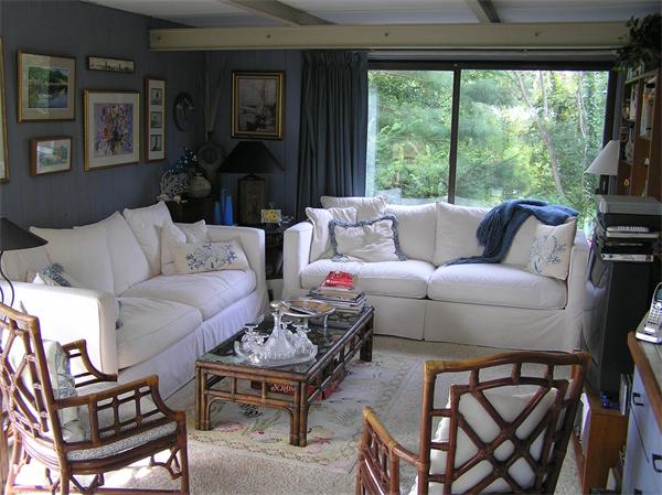 10 Brace Cove Gloucester, MA 01930 - Photo 7 of 13 a living room with furniture a large window and a flat screen tv