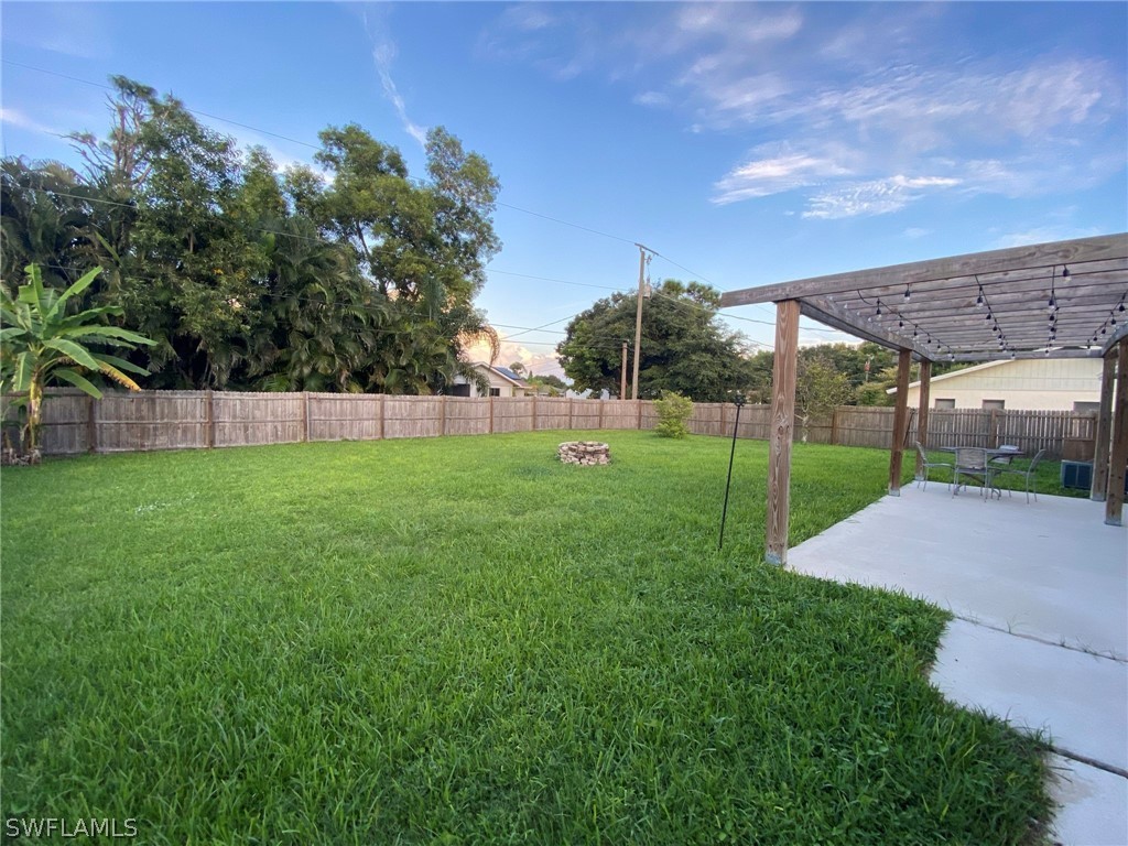 19157 Coconut Road Fort Myers, FL 33967 - Photo 3 of 26 a view of a backyard with a garden