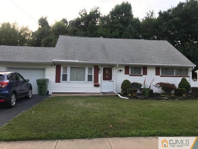 35 Caldwell Road Edison, NJ 08817 - Photo 1 of 16 a front view of a house with a garden
