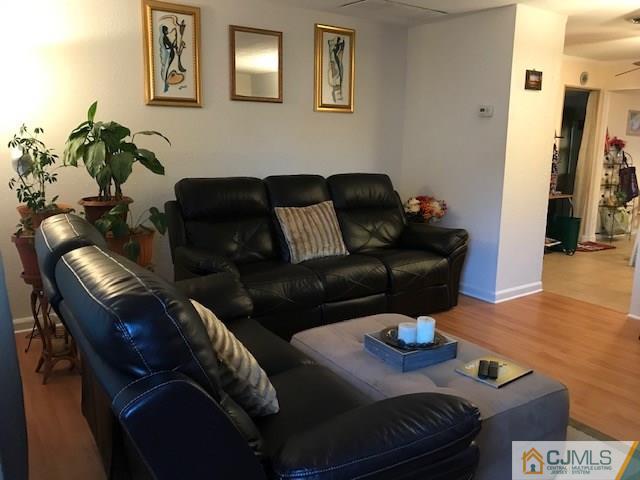 35 Caldwell Road Edison, NJ 08817 - Photo 3 of 16 a living room with furniture and wooden floor
