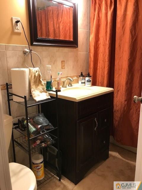35 Caldwell Road Edison, NJ 08817 - Photo 8 of 16 a bathroom with a sink and a toilet